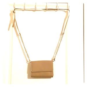 Tan & white clutch bag